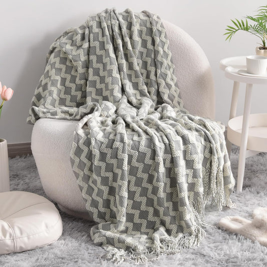 NTBAY Acrylic Knitted Throw Blanket – Lightweight, Soft & Cozy with Tassels (51×67 in, Light Grey Wave)
